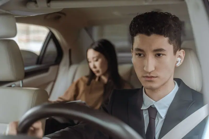 Driver and two passengers inside a car