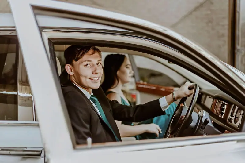 Smiling driver and passenger in a car
