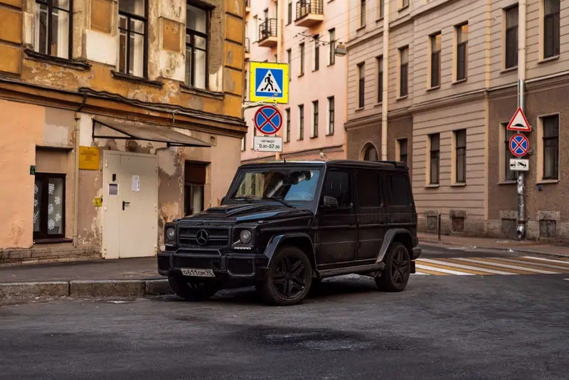 Black Mercedes G-Class on an old city street