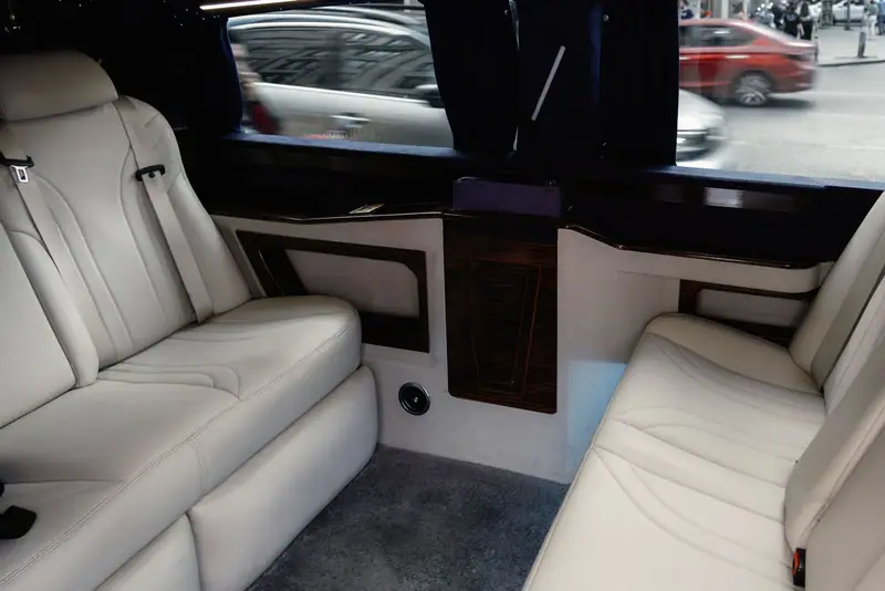 White leather seating inside a limousine