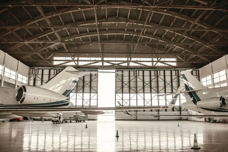 Private jets inside an airport hangar