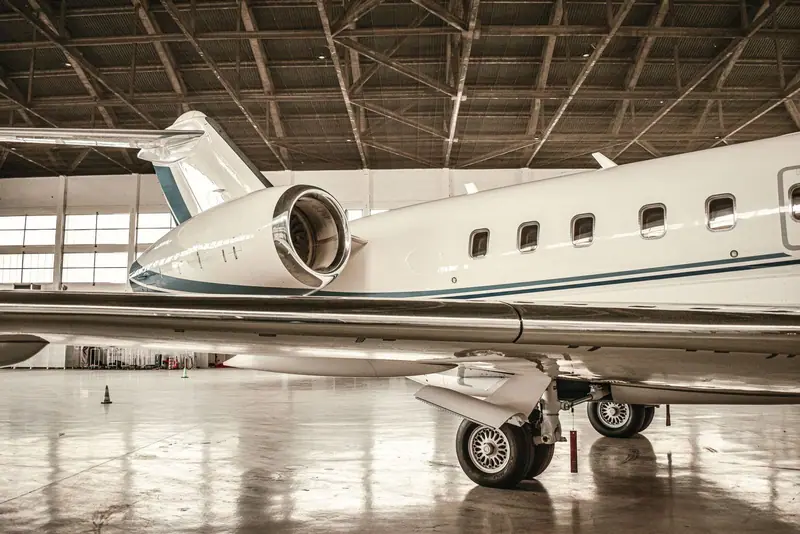 Jet inside a hangar with a glossy floor