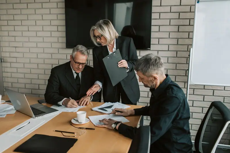 Business team reviewing documents at a table