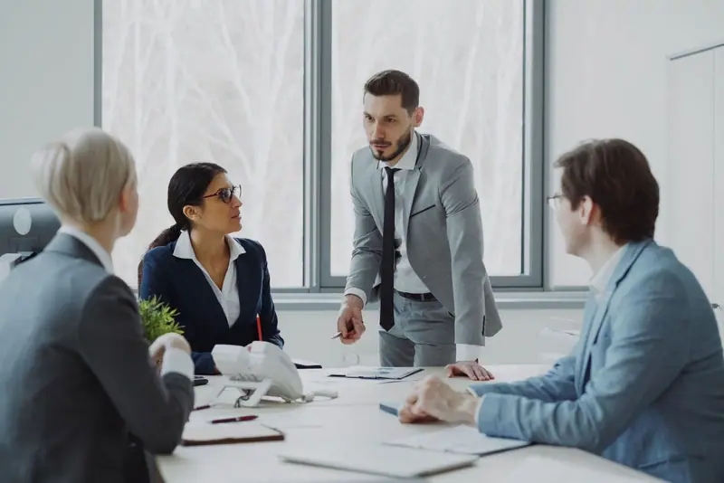 Colleagues in a meeting around a table