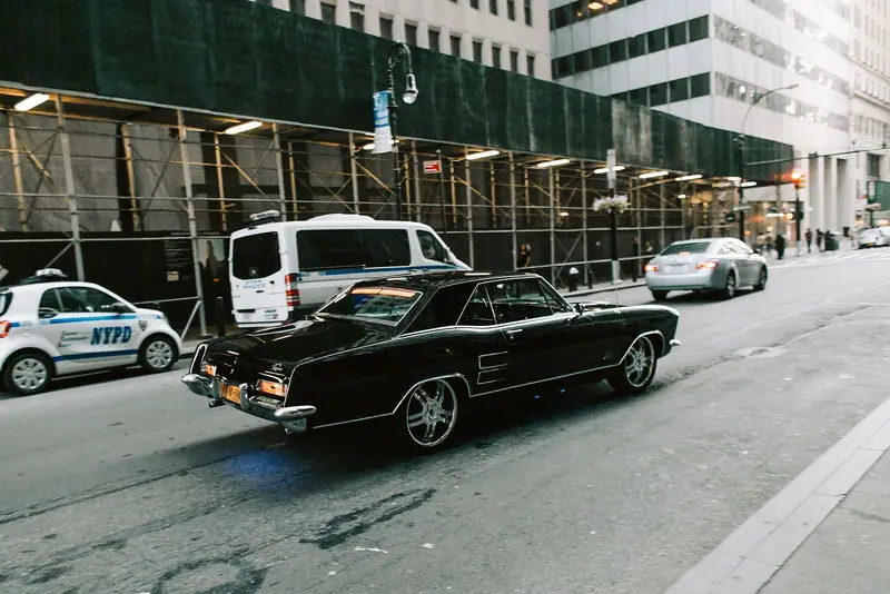 Dark classic car on a New York street