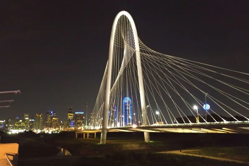 Margaret Hunt Hill Bridge lit up at night in Dallas