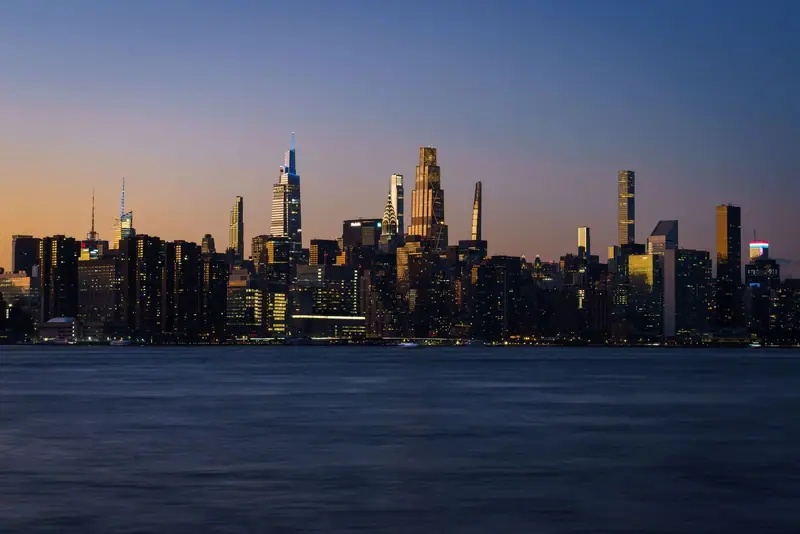 New York skyline at dusk across the water