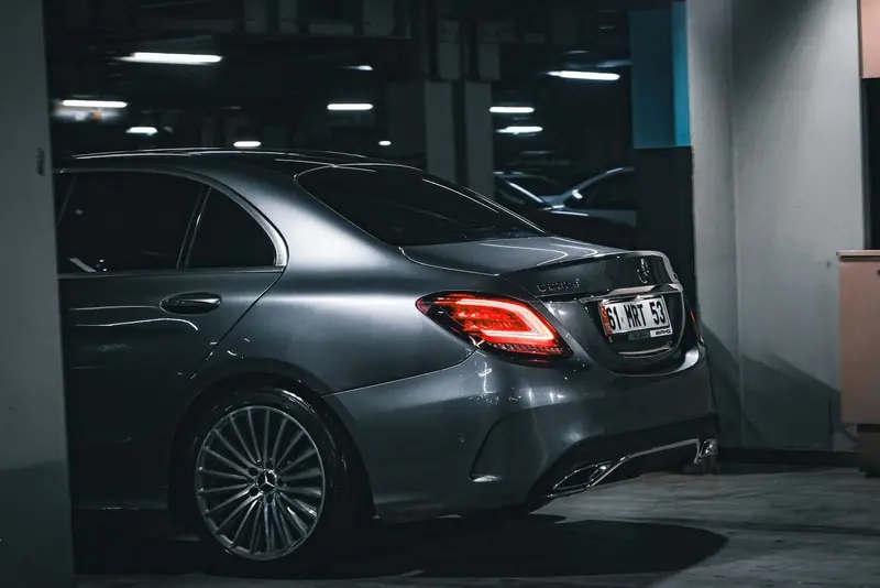 Dark grey Mercedes-Benz C-Class parked in an underground car park