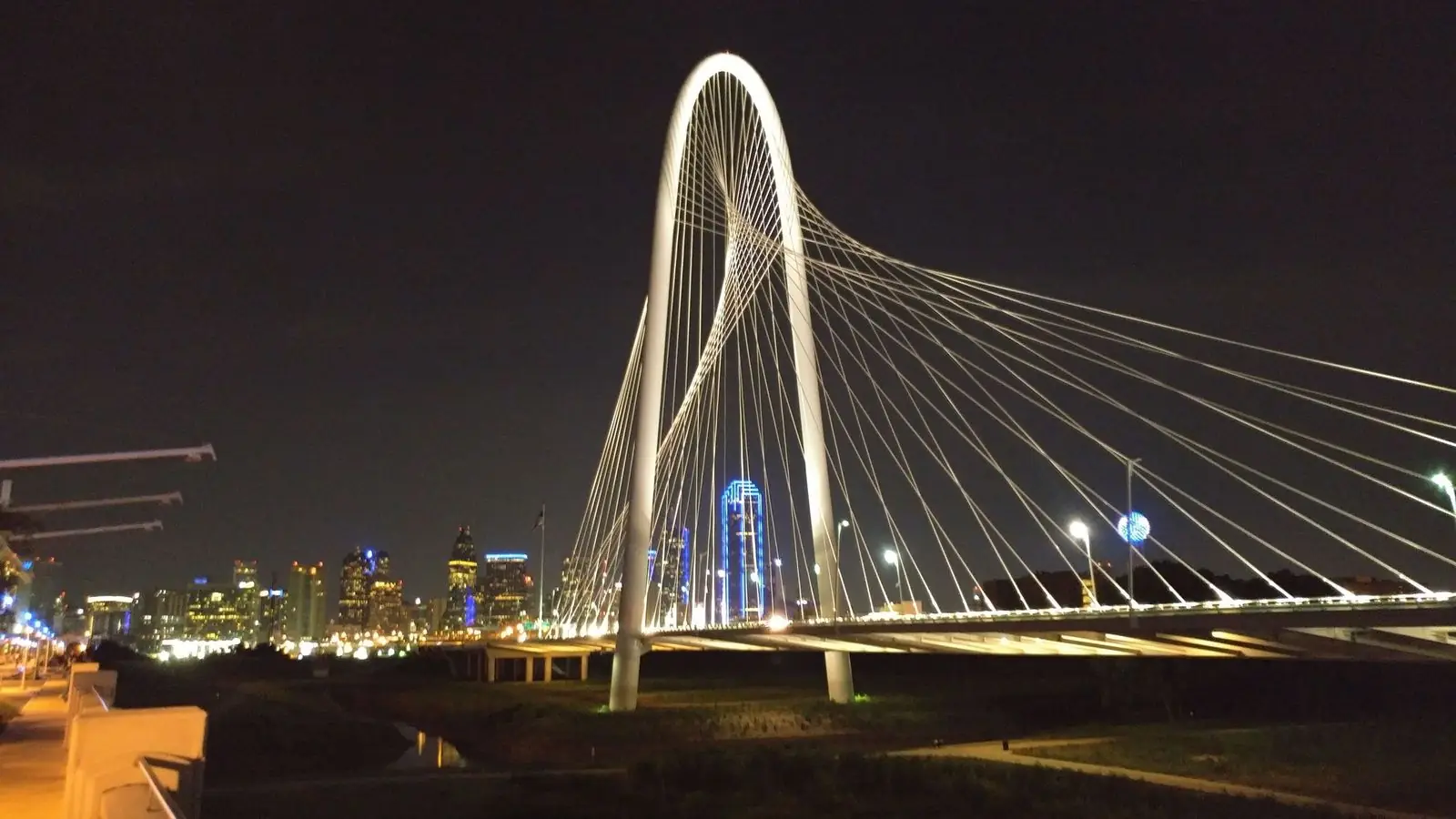 Margaret Hunt Hill Bridge lit up at night in Dallas
